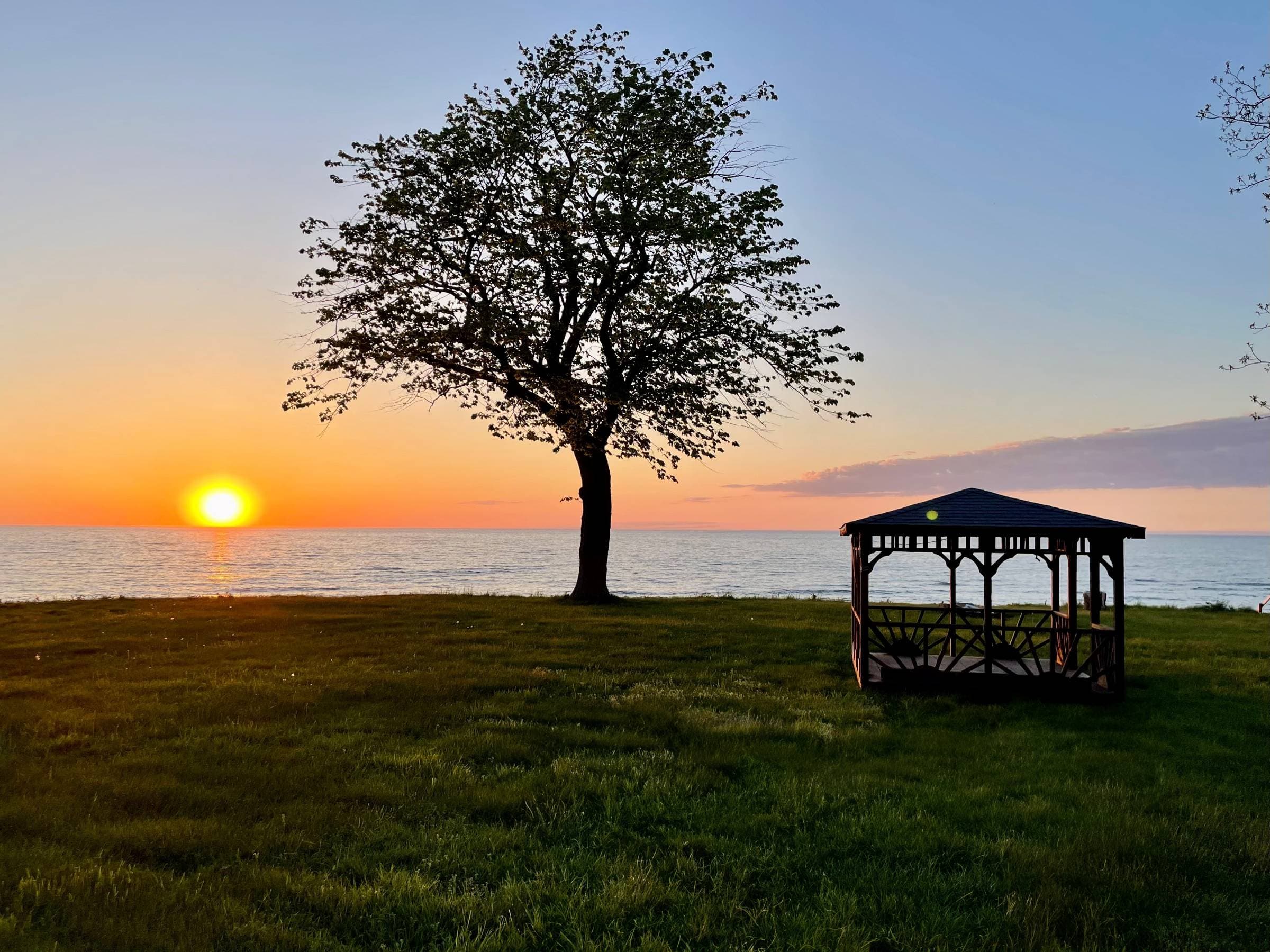 Panoramic and virtually unobstructed views from the backyard. Enjoy unbelievable Erie sunsets.