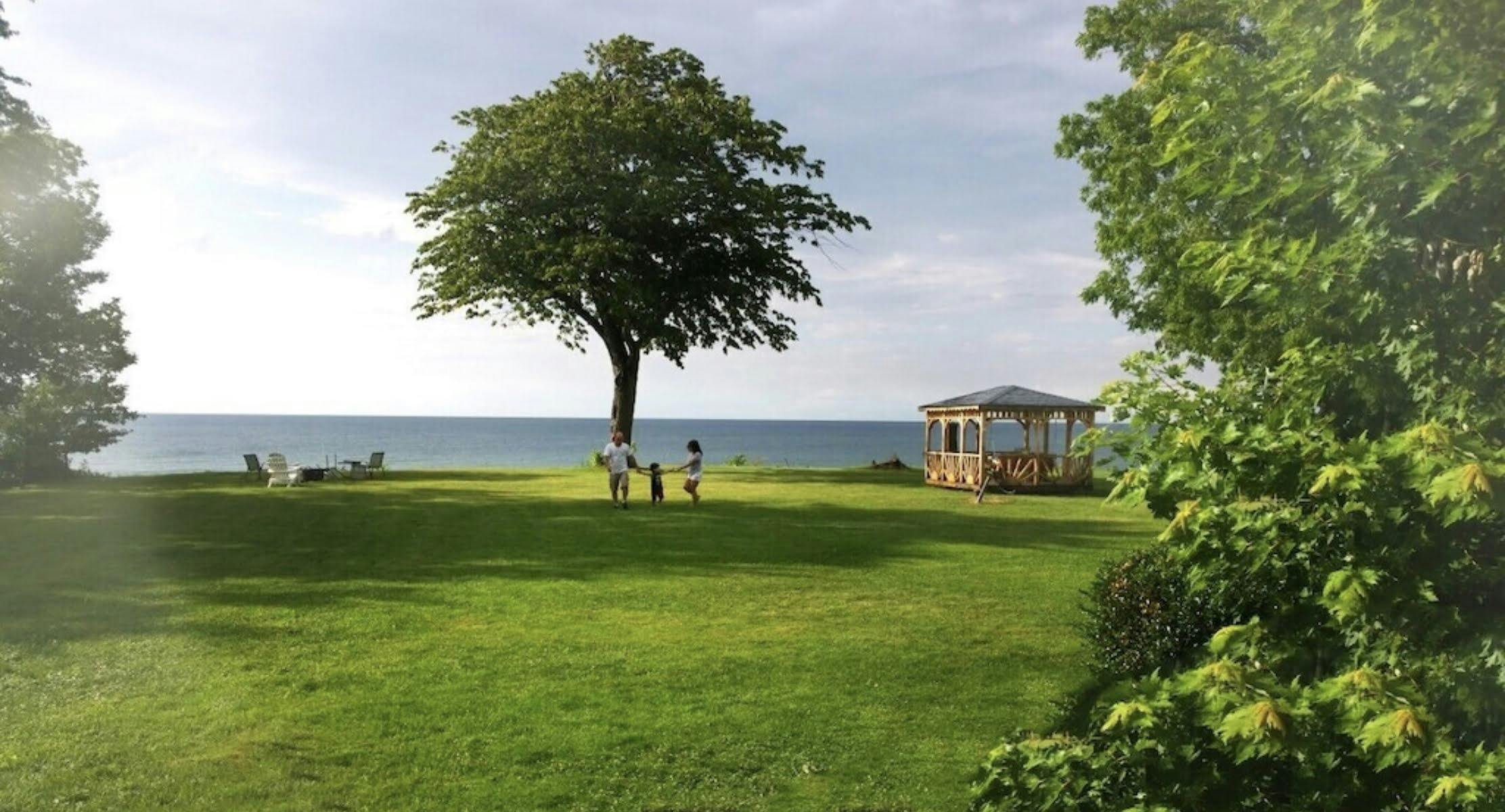 Enjoy a full acre of open landscaping in the rear of the home, providing endless views of Lake Erie.